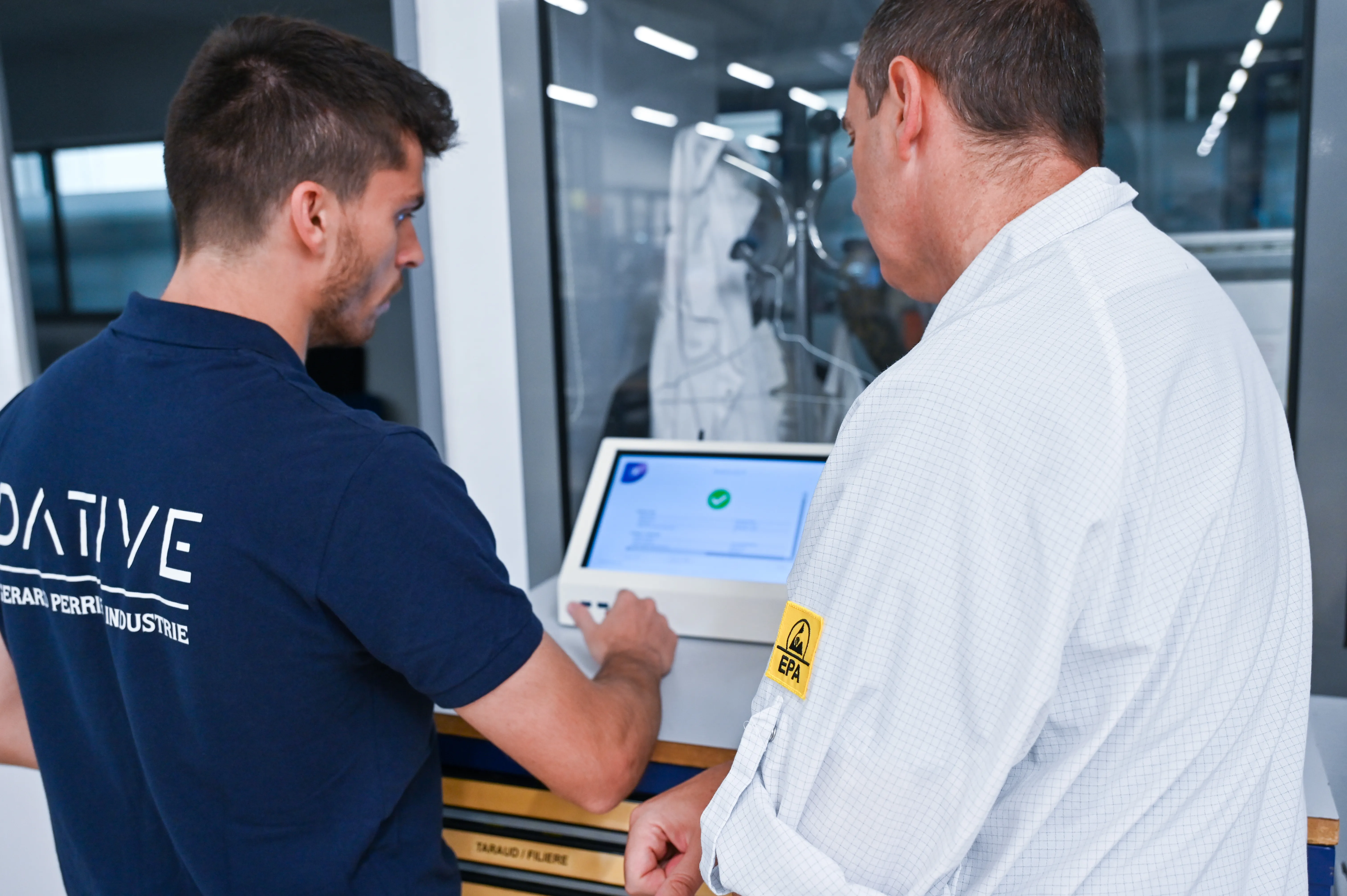 Experts in front of a white station